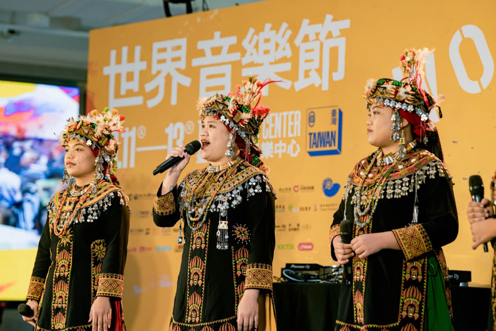 Taiwu Ancient Ballads Singers performing in traditional Paiwan dress at the press conference