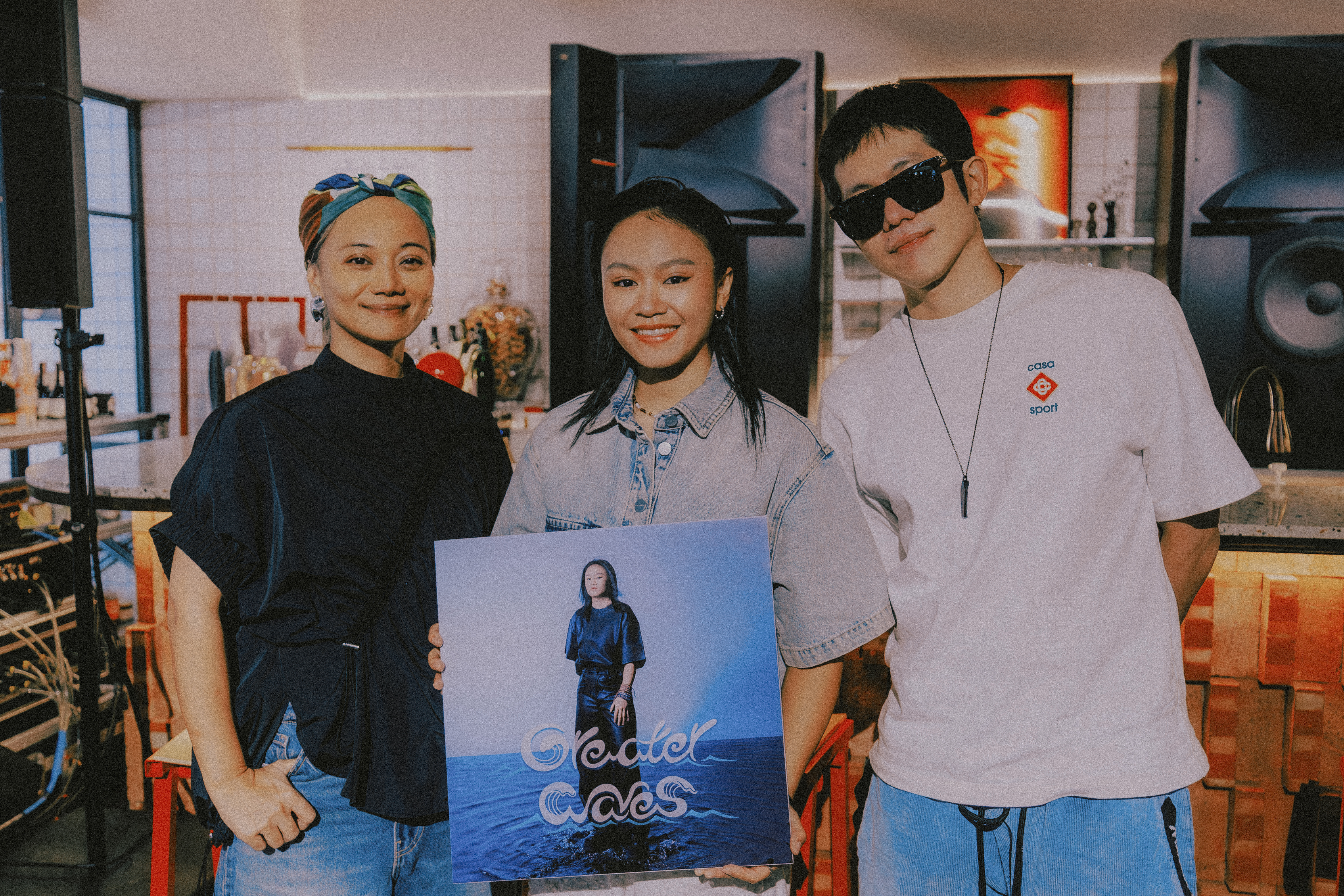 Album producers Howe Huang (right) and ABAO (left) show up in support of Makav (center) at the listening party for "Greater Waves"