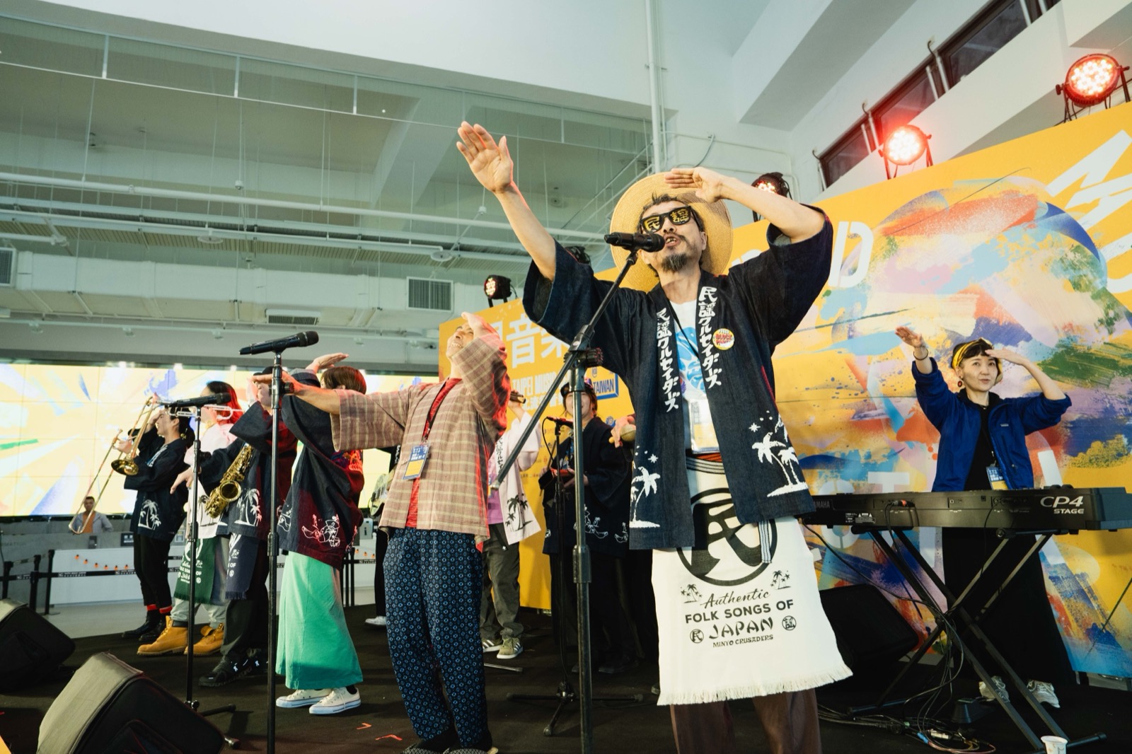 Minyo Crusaders performing at the press conference
